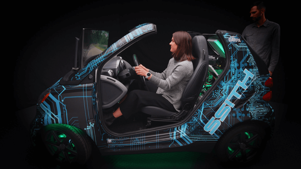DARPA SSITH driving simulator gives showgoers a visceral understanding of hacker threat, and the cybersecurity solution
